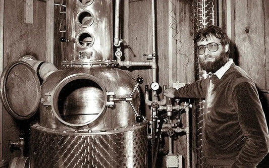 Jörg Rupf in front of a still at the St. George Distillery